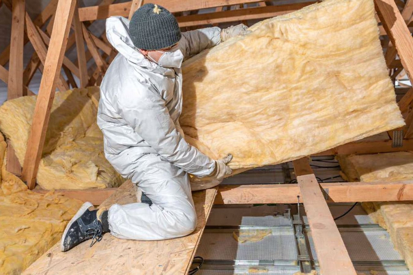 Insulation contractor working in a Kokomo, IN attic